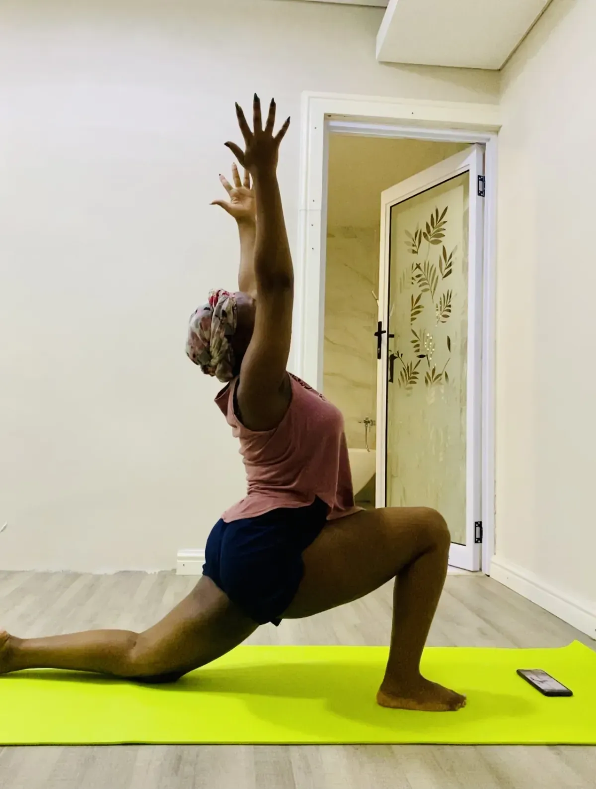 Low lunge position that opens the hip flexors in a morning stretch routine