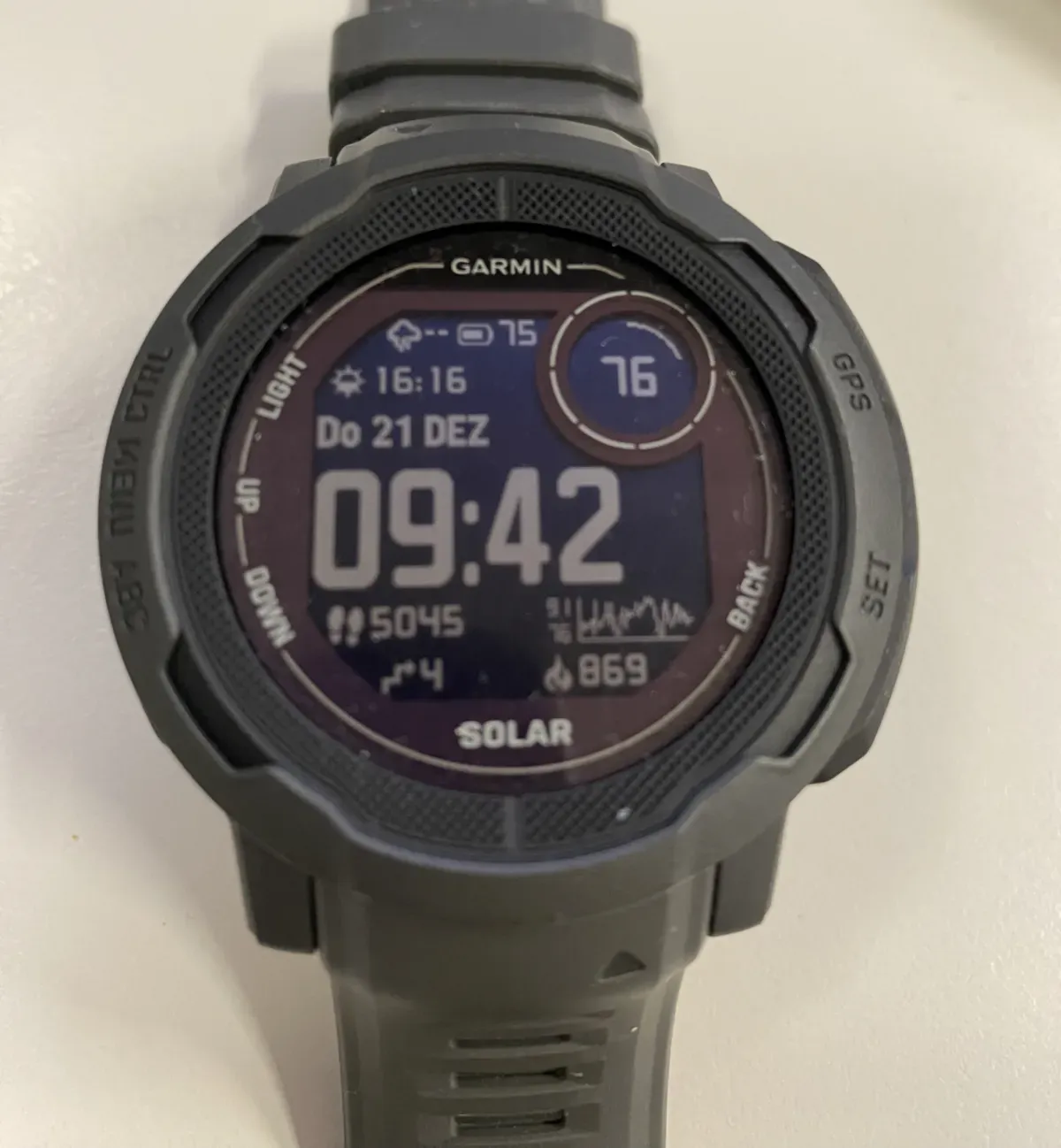 A sports watch face showing the day's step count of 5,045 below the time