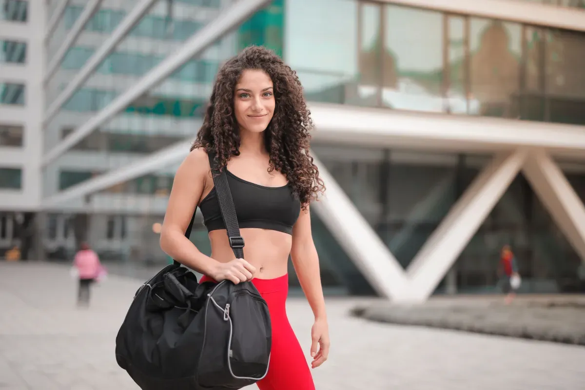 Gym bag ready to go: a person heading out in activewear with a sports bag