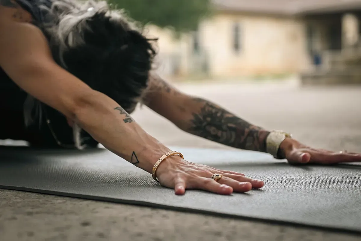 Beginner stretching on a mat in a calm full body stretching routine