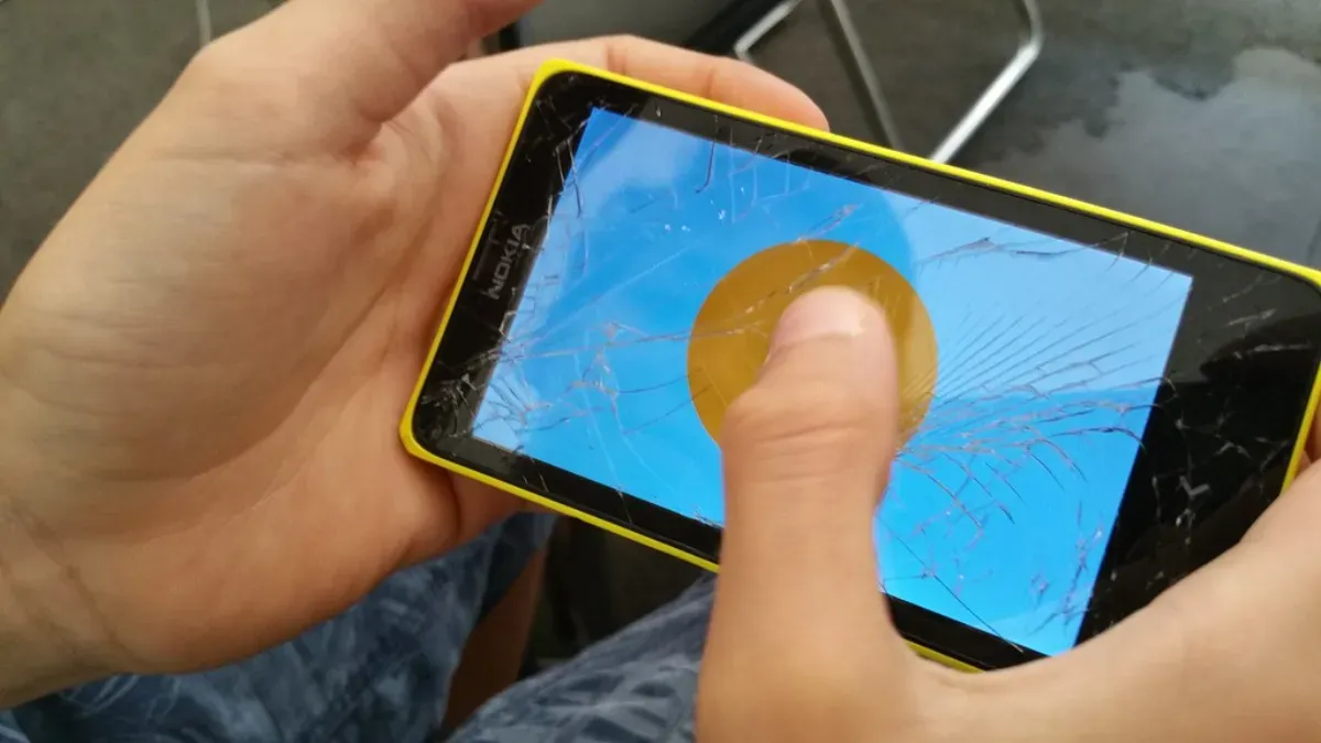 Person playing a game on a smartphone, the home of most mobile virtual pet games