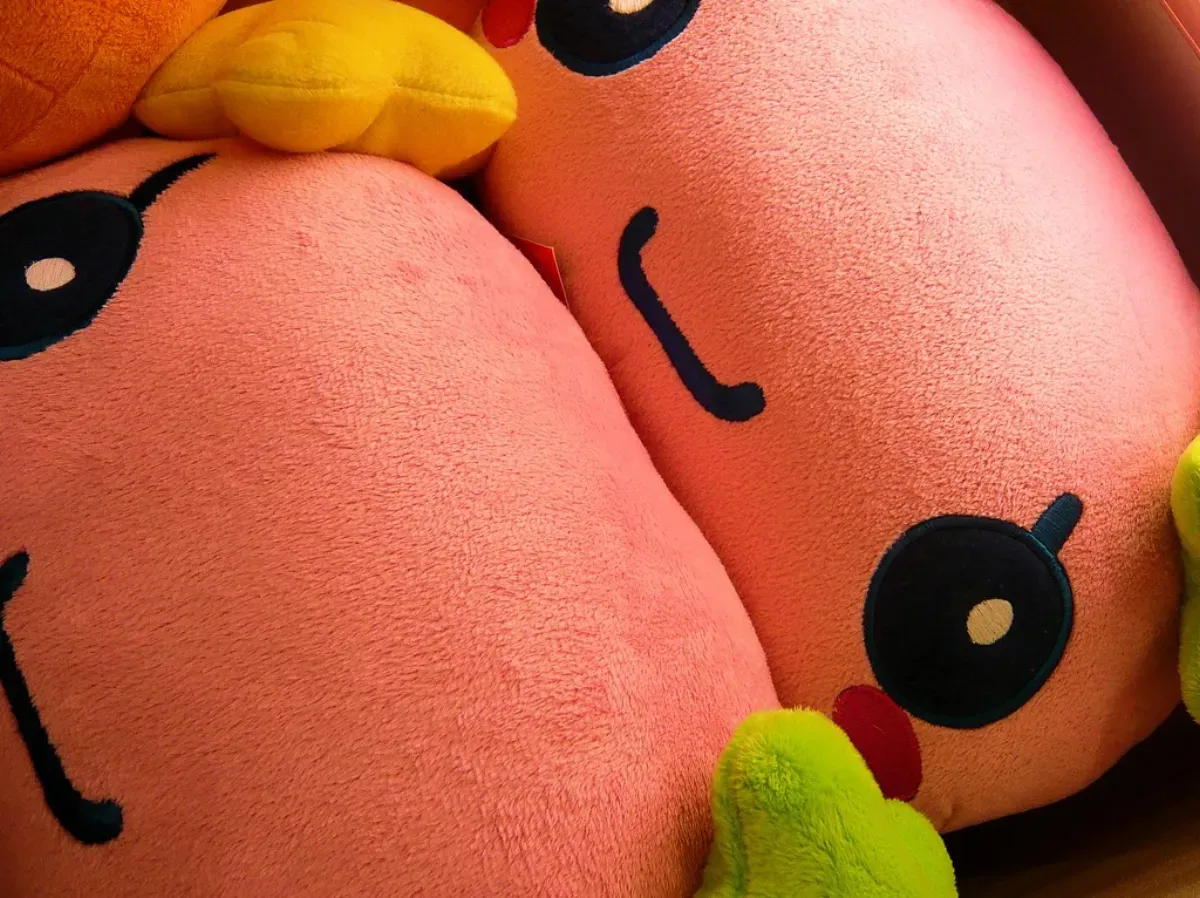 A vintage Tamagotchi keychain pet, the device that defined virtual pet games
